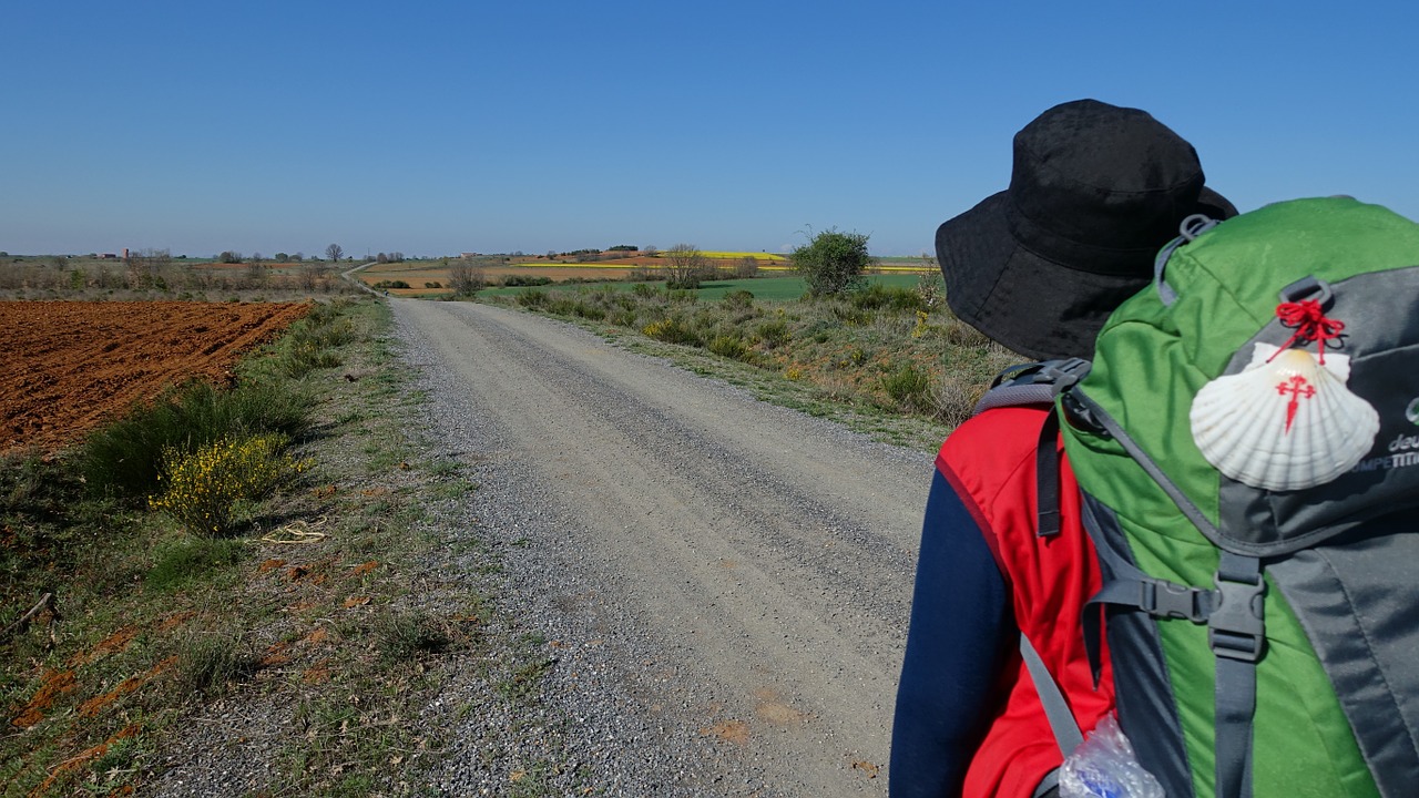 hiker with scallop on pack